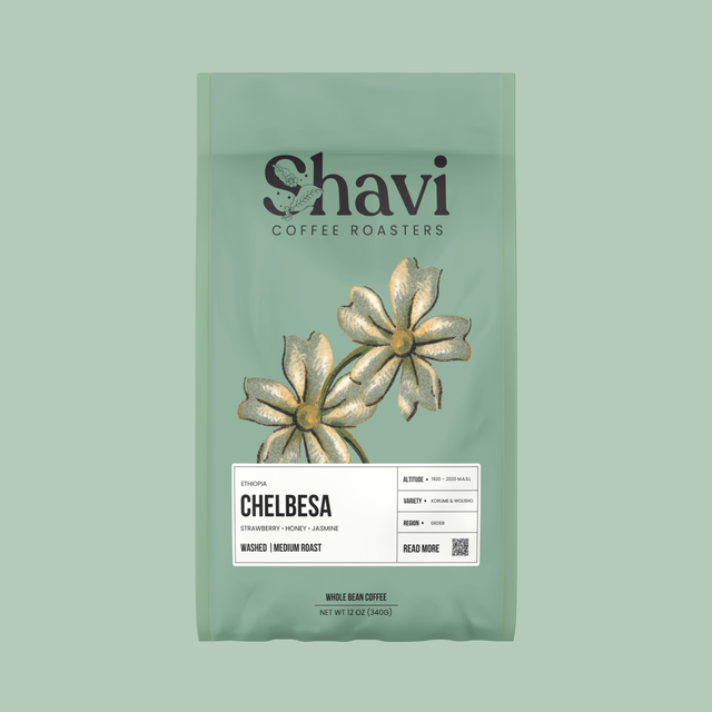 Chelbesa coffee bag by Shavi Coffee Roasters on a mint green background with botanical illustrations