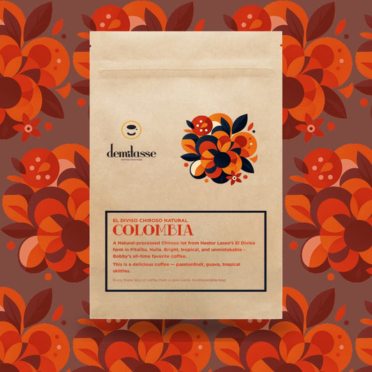 Beige coffee bag for Colombia El Diviso Chiroso Natural with a colorful tropical floral cluster design.