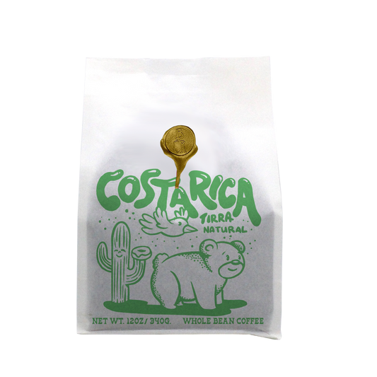 Costa Rica Tirra Natural whole bean coffee bag with bright green wildlife artwork