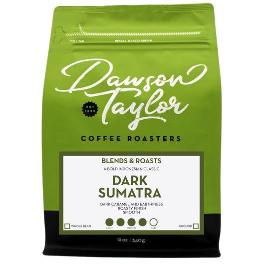 Green Dark Sumatra Mandheling coffee bag with a white label that highlights dark roast and single origin