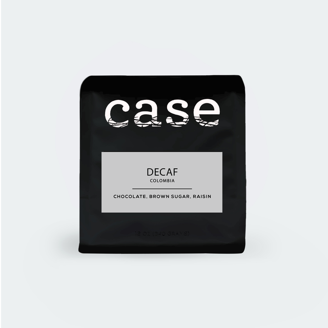 Case Coffee Roasters Decaf Colombia bag with gray label listing chocolate brown sugar and raisin