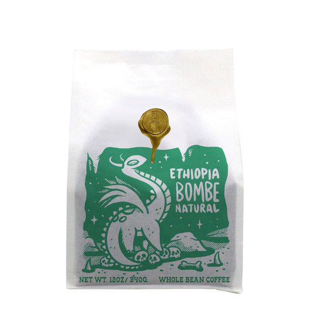 Brandywine Coffee Roasters Ethiopia Bombe Natural white bag with green graphic and a gold wax seal.
