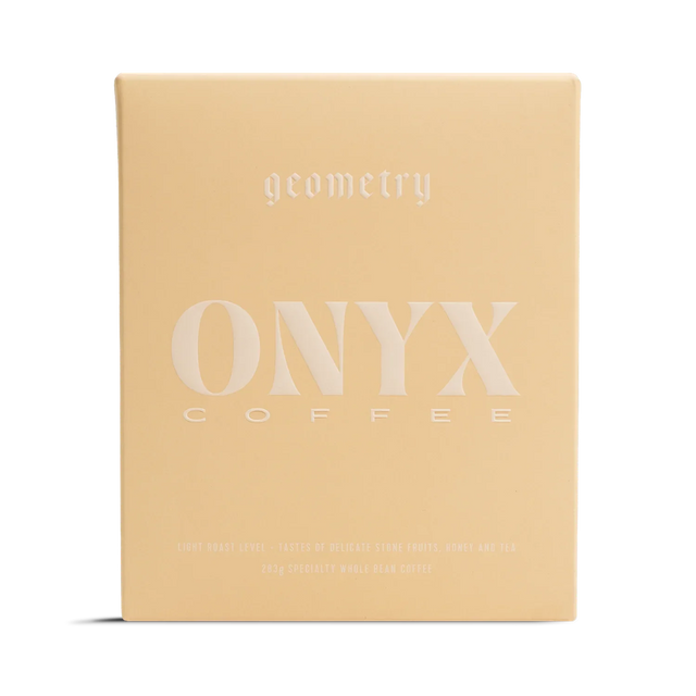 Beige Geometry coffee box with large white Onyx Coffee logo across the front.