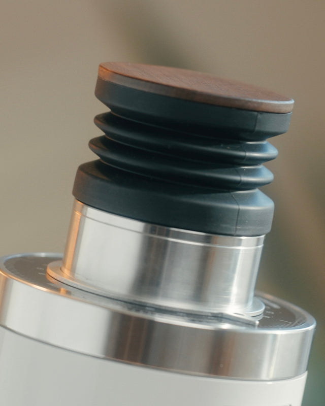 Close up of Turin DF64 Gen 2.5 top showing a wood lid atop stacked black collars.