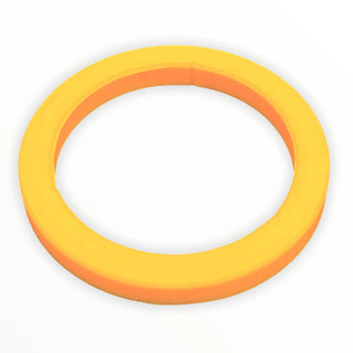 Close-up of yellow silicone gasket for E61 group head on white background
