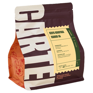 Kenya Kirinyaga coffee packaging with a yellow processing label visible