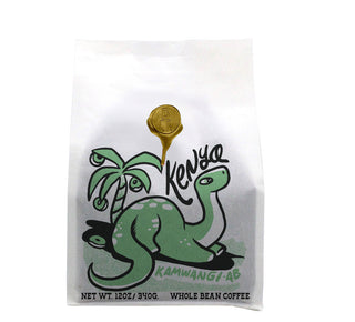 Kenya Kamwangi AB whole bean coffee bag with a playful green dinosaur illustration