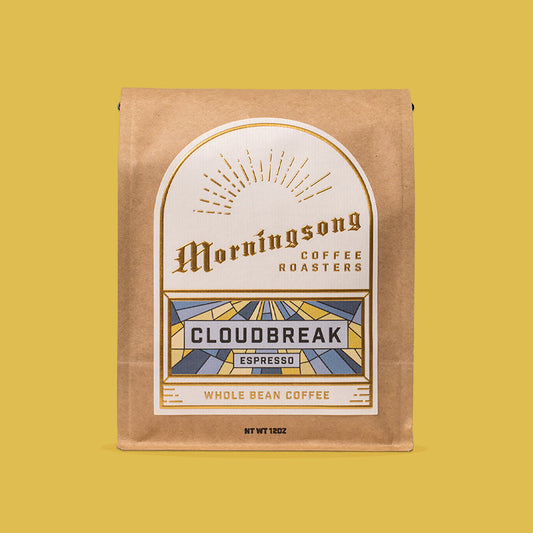 Morningsong Cloudbreak Espresso whole bean coffee bag on mustard yellow backdrop