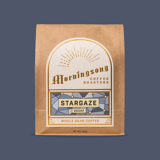 Stargaze Decaf whole bean coffee bag by Morningsong Coffee Roasters with a white arched label and mosaic panel.