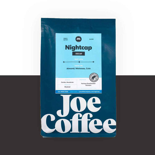 Nightcap Decaf coffee bag with blue label and bold Joe Coffee typography
