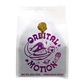 White Brandywine Orbital Motion espresso blend bag with a purple space themed illustration.
