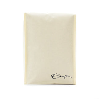 Beige coffee bag with a handwritten signature at the bottom