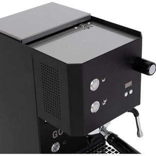 Black Profitec GO espresso machine with visible brand logo on a white background by Clive Coffee.
