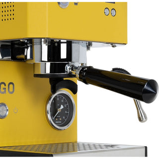 Close-up of a yellow Profitec GO espresso machine with a black portafilter handle, pressure gauge, drip tray, and steam lever on a white background by Clive Coffee.