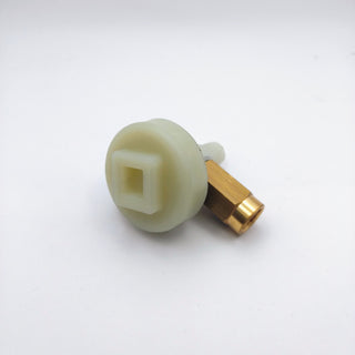 Pale green vibratory pump pulsor with copper fitting for Quick Mill espresso machines.