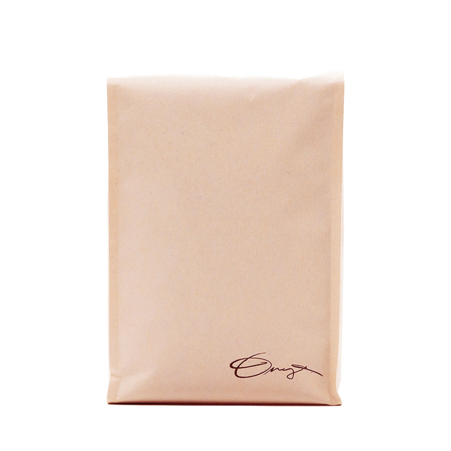 White Geometry coffee bag with subtle tan text across the front