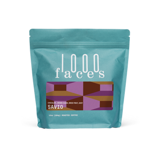 Turquoise Savio coffee bag from 1000 Faces Coffee with a geometric label.