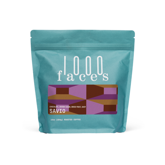 Turquoise Savio coffee bag from 1000 Faces Coffee with a geometric label.
