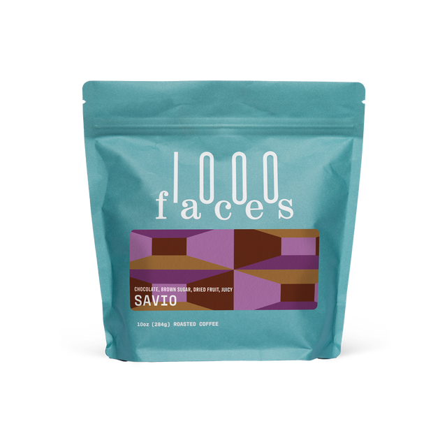 Turquoise Savio coffee bag from 1000 Faces Coffee with a geometric label.