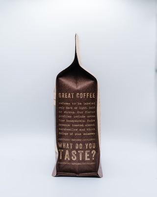 Opened top of the Decaf Esmeralda bag showing the fold and dark interior