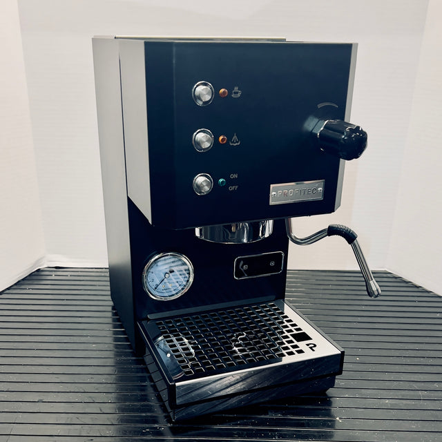 Open box Profitec GO espresso machine front panel with two chrome knobs and steam wand