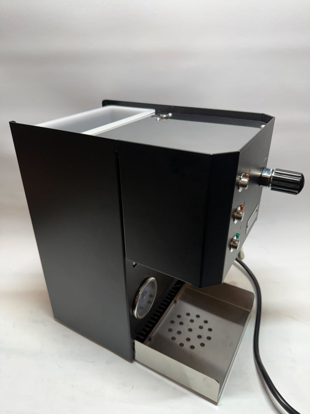 Open box Profitec GO espresso machine side view with black body chrome details and drip tray.