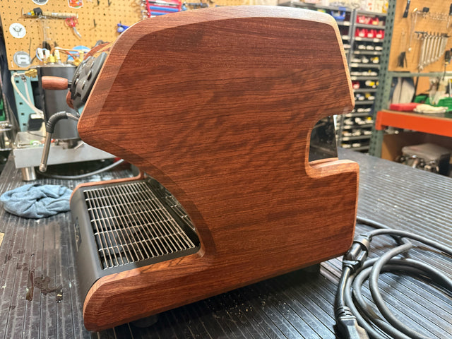 Bubinga wood exterior panel of a LUCCA A53 Mini espresso machine