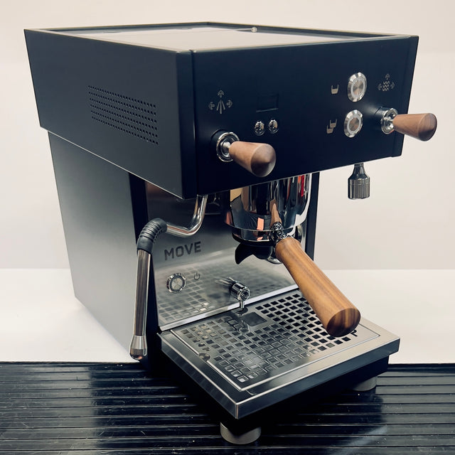 Profitec MOVE espresso machine side view in dark metal with wooden handles and control dials.