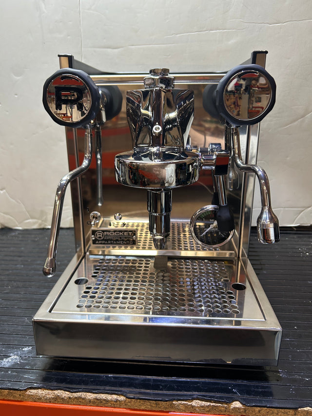 Front view of a Portland Pickup Rocket Appartamento Copper espresso machine with chrome finish and dual portafilter handles.