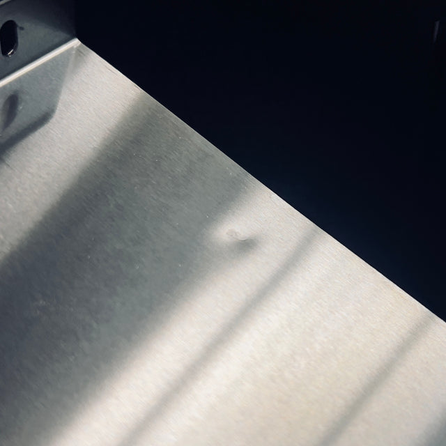 Close up of brushed stainless steel surface on a Profitec GO espresso machine body