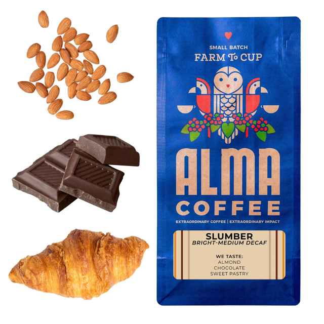 Blue Alma Coffee Slumber bag with almonds chocolate and a croissant beside it