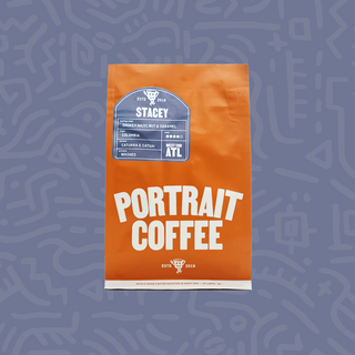 Orange Stacey coffee bag from Portrait Coffee featuring a blue Stacey label and Colombia origin.