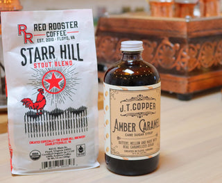 Starr Hill Stout Blend bag beside a J T Copper Amber Caramel Cane Sugar Syrup bottle on a wooden counter