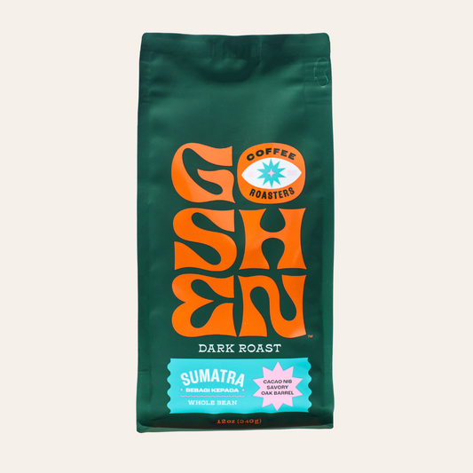 Green Sumatra Bebagi Kepada coffee bag with a bold orange logo