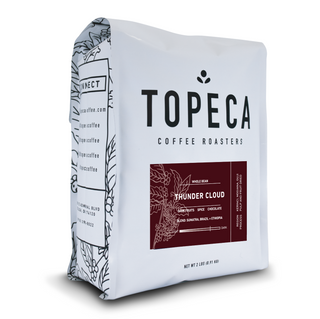 Thunder Cloud coffee bag from Topeca Roasters with bold TOPECA logo and a maroon Thunder Cloud label