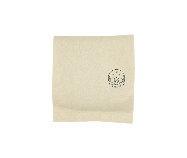Monarch coffee packaging in a natural kraft bag with a small skull logo on the lower right