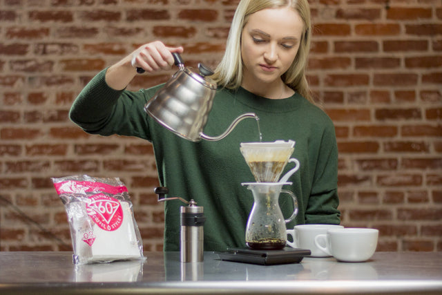 Hario V60 02 Paper Filters being used with a glass Hario V60 dripper and Hario Kettle, Clive Coffee - Lifestyle