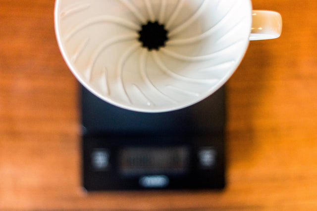 Hario V60 White Ceramic Coffee Dripper on Hario scale, Clive Coffee - Lifestyle