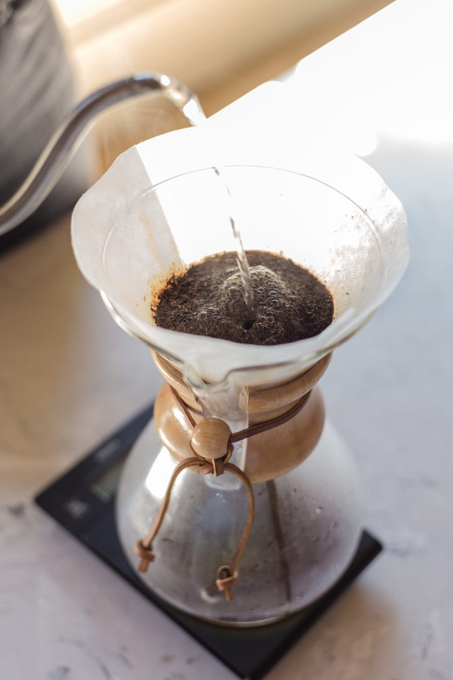 Chemex Classic Eight Cup Coffee Maker being used with a pour over kettle, Clive Coffee - Lifestyle