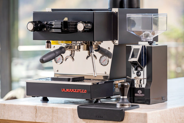 Pullman Big Step Tamper with Black Linea Mini espresso machine from Clive Coffee - Lifestyle