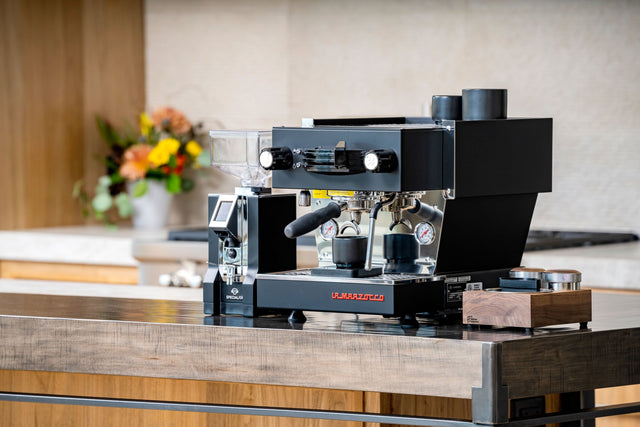 Saint Anthony Industries Bloc Tamp Station with La Marzocco Linea Mini espresso machine from Clive Coffee - lifestyle - large