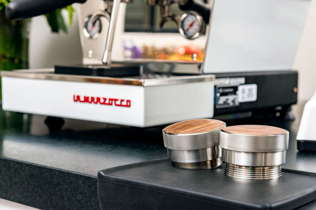 Saint Anthony Industries New Levy Tamp next to a La Marzocco Linea Mini, Clive Coffee - Lifestyle - large