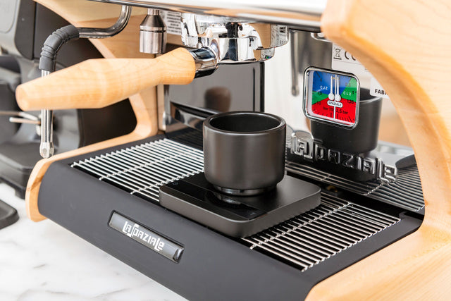 Clive Bottomless Portafilter with LUCCA A53 Mini espresso machine pulling a shot, Clive Coffee - Lifestyle