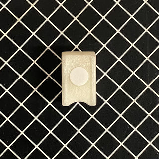 La Spaziale water tank magnet float a small beige block with a white circular magnet