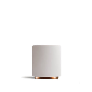 Two Monty cups with white matte exteriors and copper bottoms arranged side by side