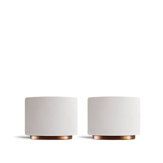 Pair of Fellow Monty double wall espresso cups with copper bases on a white background