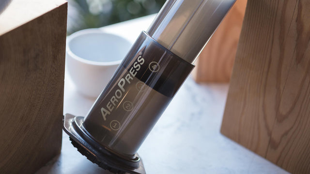 Aero Press Coffee Maker between wood blocks, Clive Coffee - Lifestyle Image